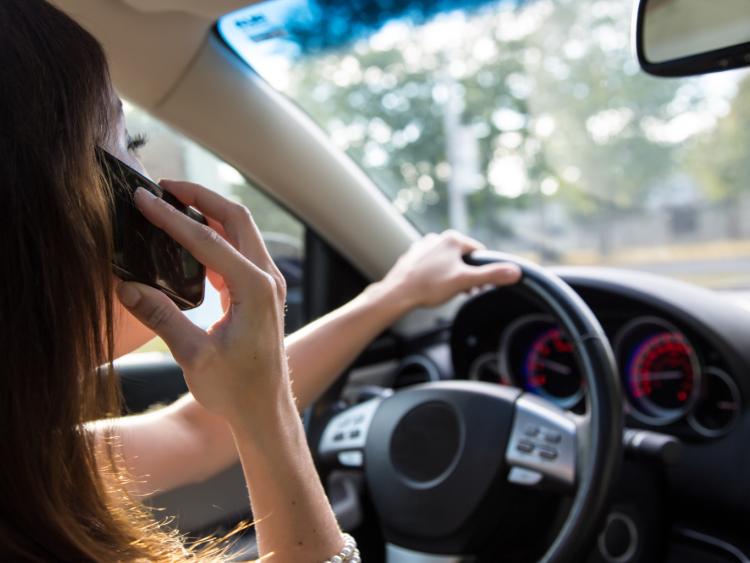 Mobile phone use while driving is illegal.