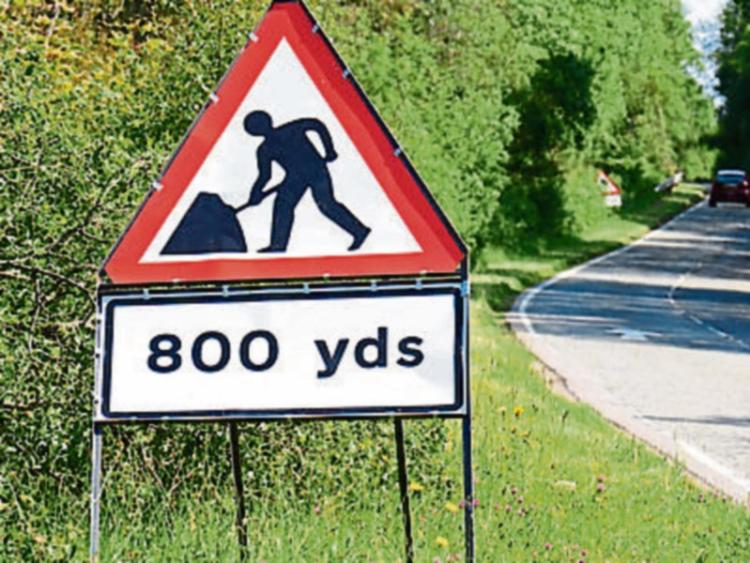 Patching and signs on way for road in Camross
