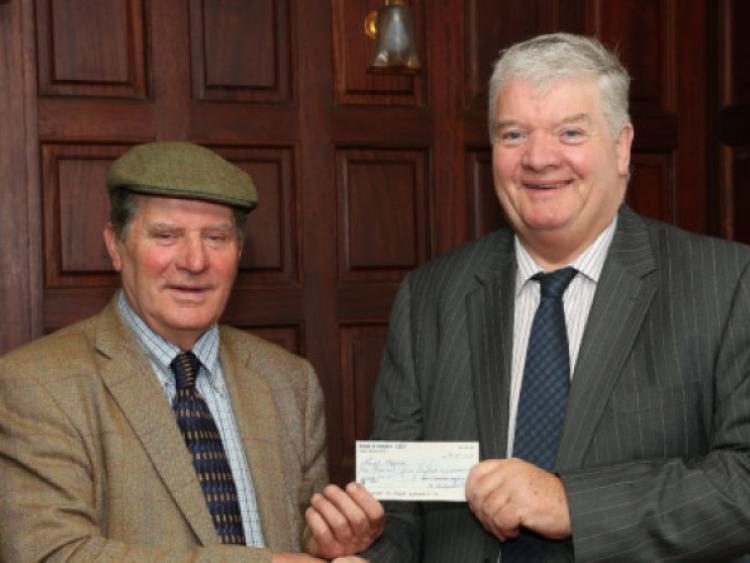 Ken Graham, President of the Irish Steam Preservation Society, Stradbally, presenting a cheque for �1,500 to Seamus O'Donoghue ( Chairman , Laois Hospice Foundation).  Photo: Michael Scully.