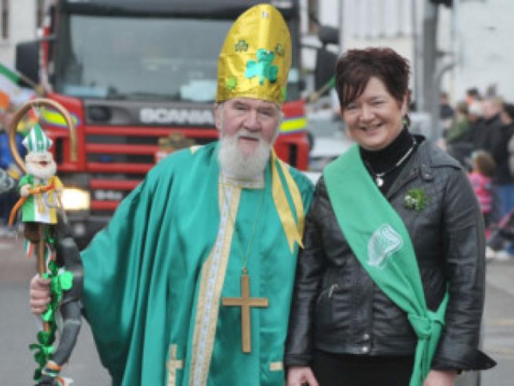 St Patrick and Grand Marshall, Patricia Conroy leading the Mountmellick St. Patrick's Day Parade.                                                  Photo Kevin Byrne