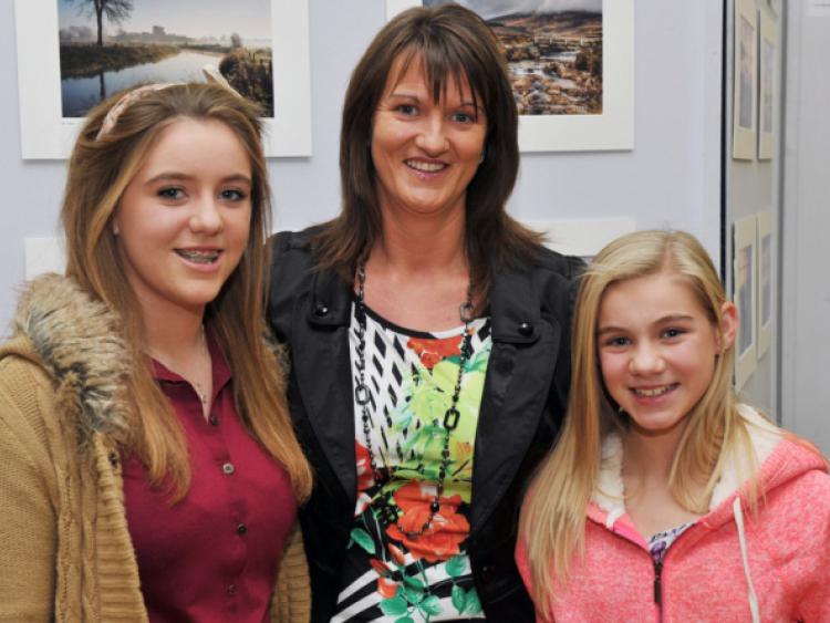 Chloe, Dominica and Meegan Scully enjoying the Mountmellick Camera Club's annual exhibition of photography.                       Photo Kevin Byrne