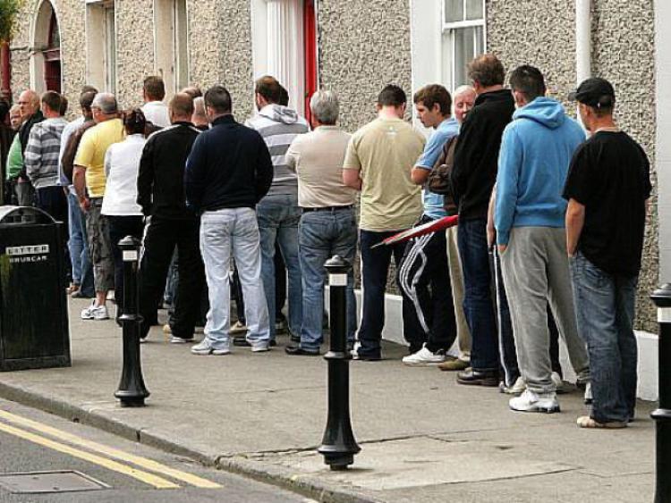 Dole queue outside the Social Welfare Office, Portarlington. Photo: Michael Scully .