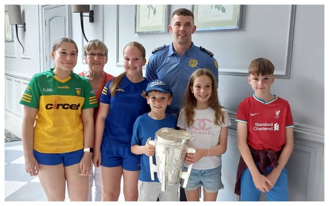 Ronan Maher poses with supporters and the Liam MacCarthy Cup during his Portlaoise homecoming