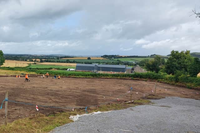 The field has distinct areas of darker colours, which he explains prove there was a high bank at one end, dug painstakingly deep to keep out wild animals or intruders.
