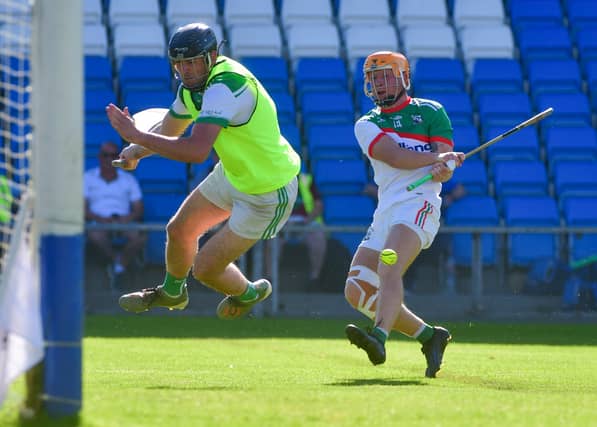Stephen Kelly, Rosenallis bravely saves Mark Kavanagh, Rathdowney Errill Photos: Denis Byrne