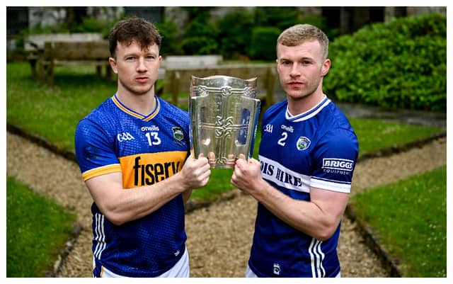 Jake Morris of Tipperary and Podge Delaney of Laois with the Liam Mac Carthy Cup. Photo by Brendan Moran/Sportsfile