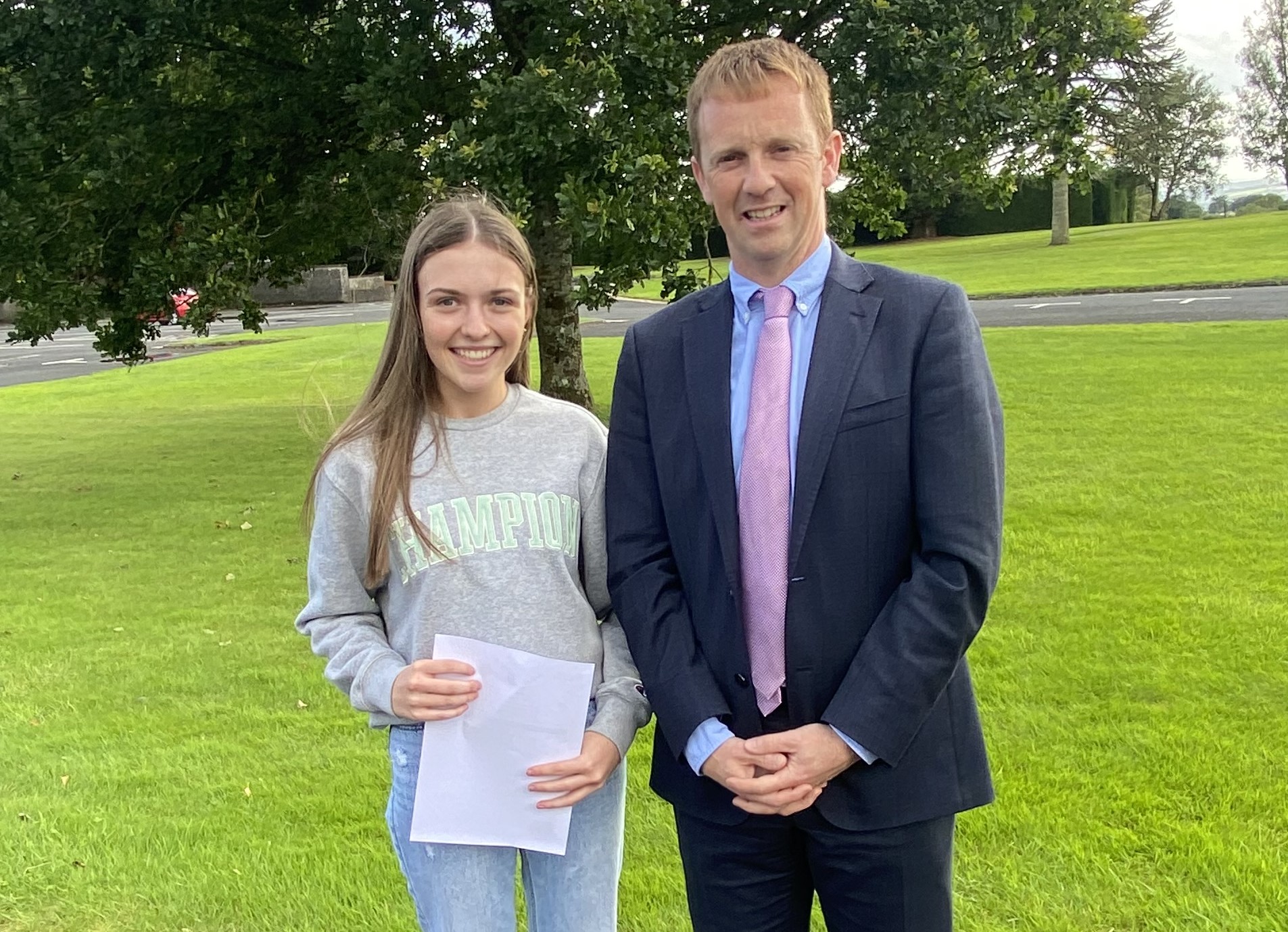 Emma Carney celebrates top marks in her Leaving Cert with Heywood Community School Principal Eamon Jackman.
