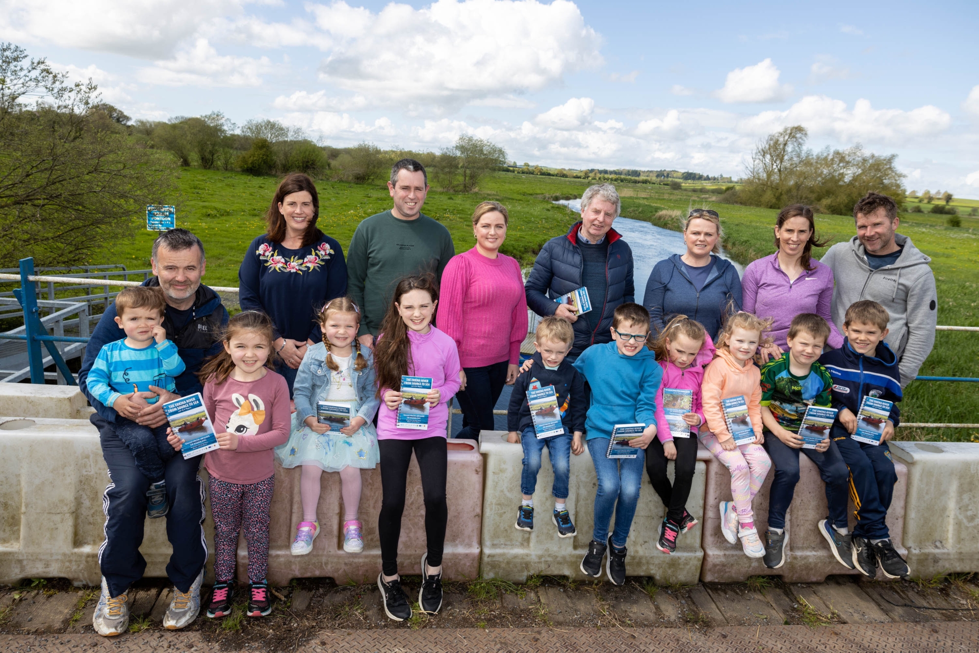 Author Michael G Phelan with the Coonan, Dunphy and Ryan families with copies of the book ‘The Erkina River From Source To Sea at the famous Woodenbridge over the River Erkina. Pictures: Alf Harvey
