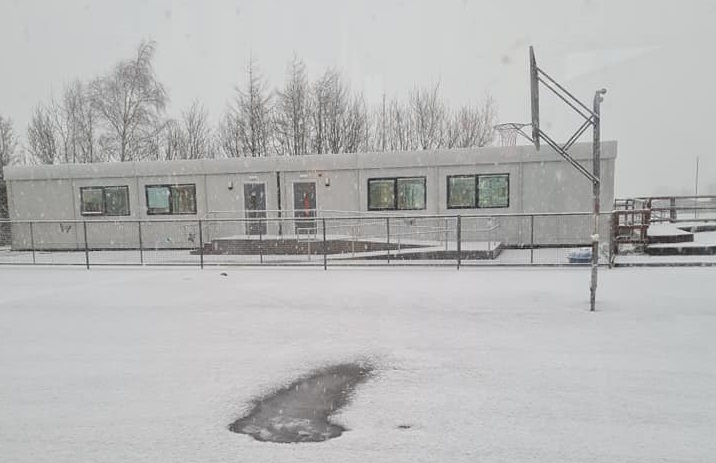 A snowy scene at Raheen NS, where road salting is requested.
