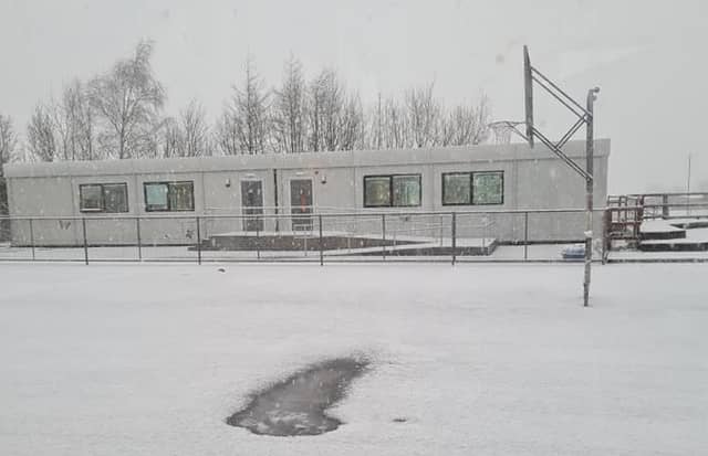 A snowy scene at Raheen NS, where road salting is requested.
