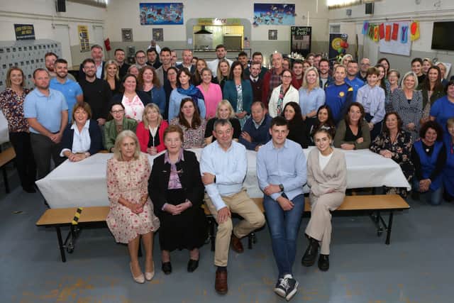 Below: Seamus Bennett and family surrounded by Colaiste Iosagain Staff, at his retirement function at the school.