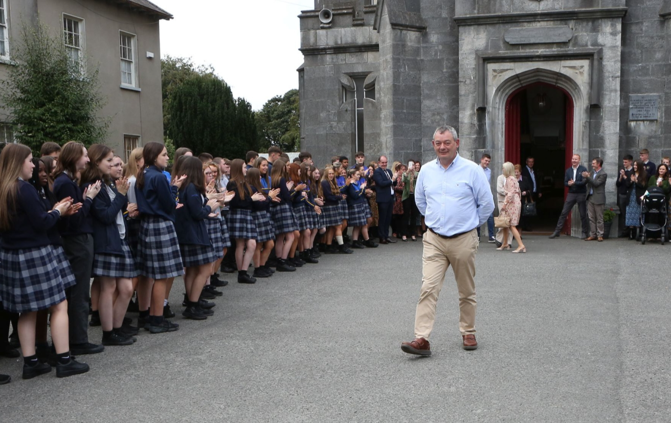 Colaise Iosagain students form a guard of Honour for retired Principal , Seamus Bennett  as he leaves St. Michael's church, Portarlington after a Mass for the school.    Photo: Michael Scully.
