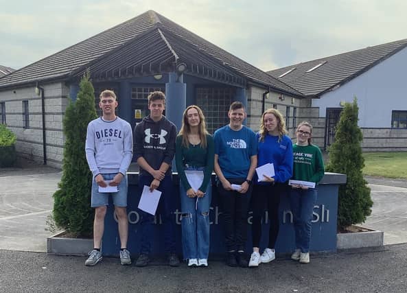 Denis Grehan, Noel Leech, Caoimhe Kelly, Brian Multaney, Niamh Donogher and Elaine Conway. receiving their Leaving Cert results.