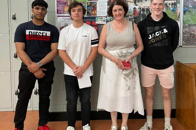Below: Principal Maura Murphy with Sam Sunni, Marc Bracken and Dara Phelan. 