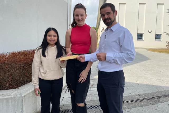 Below: Ashanti Shane Fragante and Anastasia Gordejeva with Bill Coolahan Deputy Principal. 