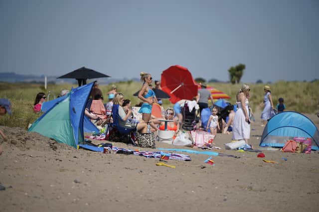 Some sun worshippers bathed in the heat, while others retreated to shaded picnic benches to take a break from the unusually high temperatures for Ireland.