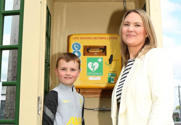 Scott Courtney with his mother Sally Courtney (Chairperson , Ballybrittas Tidy Towns) with the new Defibrillator in an old kiosk. Photo: Michaell Scully