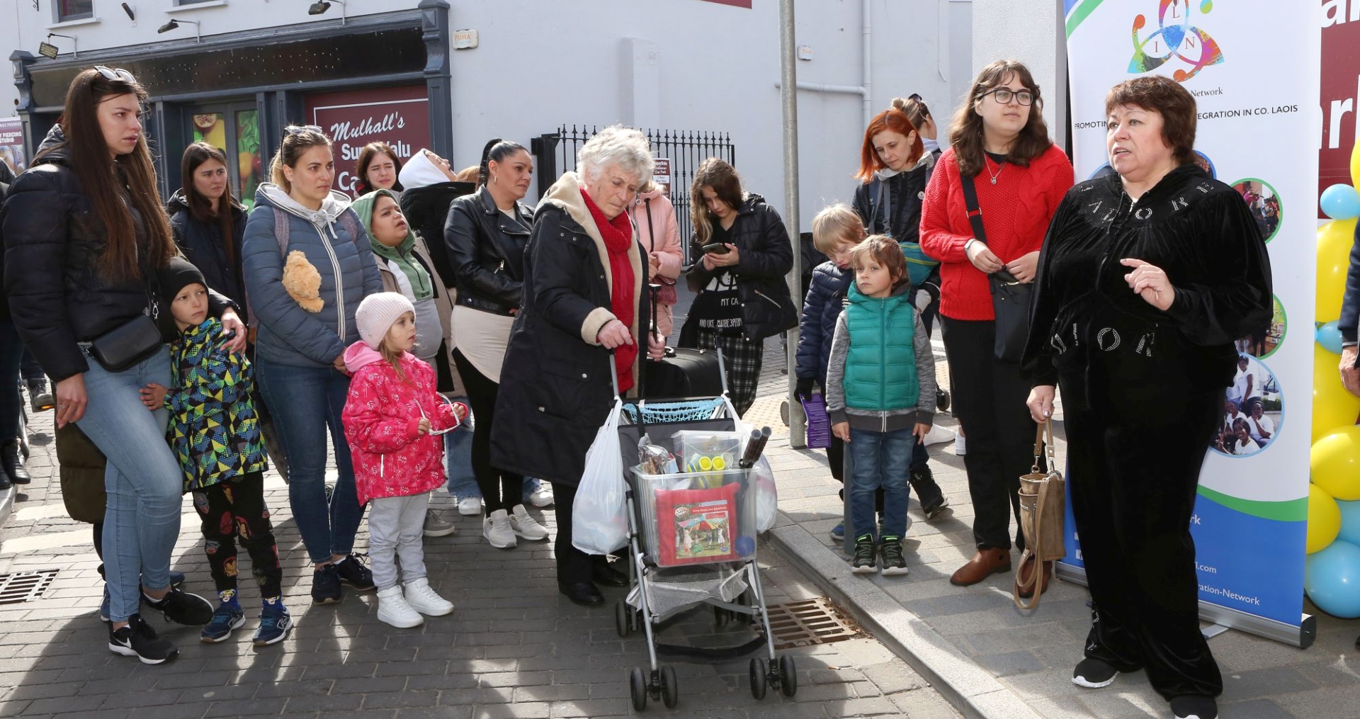 Some of the Ukrainian refugees at the opening of the Zero Cost shop on Bull Lane, Portlaoise. Picture: Michael Scully