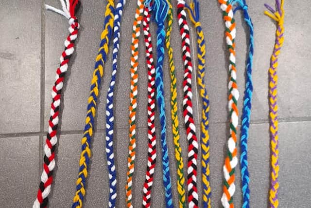 Other children who attend the centre are making and selling colourful hair braids, hairbands and bracelets.