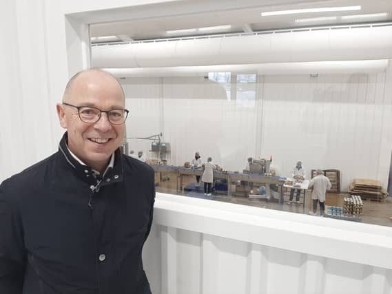 Vincent Cleary, Glenisk managing director, with the first pots of organic yogurt rolling off the new production line in Killeigh after last year's devastating fire