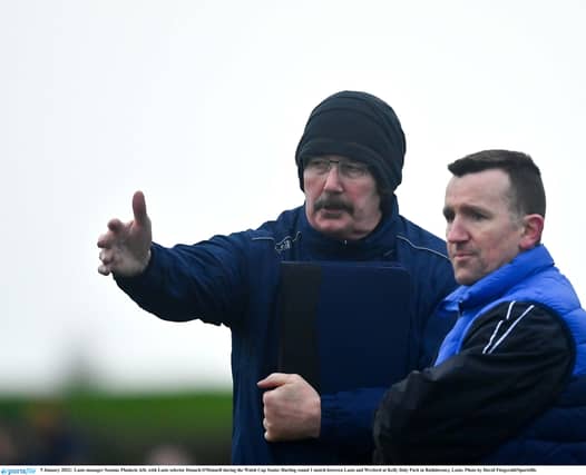 Laois manager Cheddar Plunkett alongside coach Francis Forde.