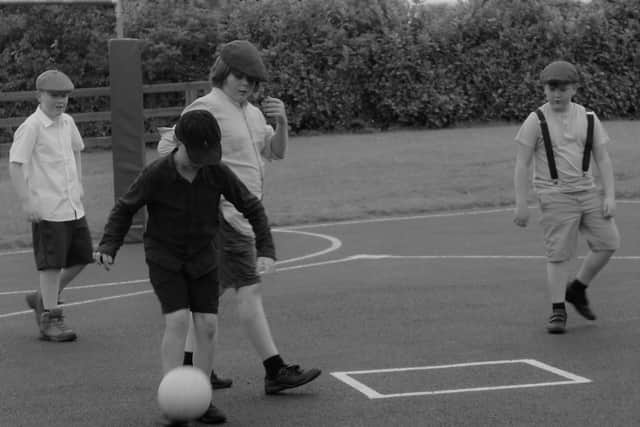 Below: Children playing old style football in the Rock NS for Emer Dunne's music video.