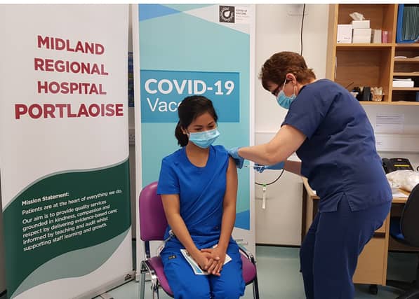 Aidel Aurel Casabar, staff nurse ED, is the first person in the Midland Regional Hospital Portlaoise to be vaccinated . She was vaccinated by Mary Gilligan, Clinical Placement Co-ordinator.