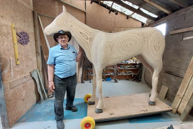 Using the same outline as Katcha, Charlie cut and glued multiple timber layers, then planed and sanded them down to a smooth curved surface, with the coloured layers of wood creating beautiful patterns.