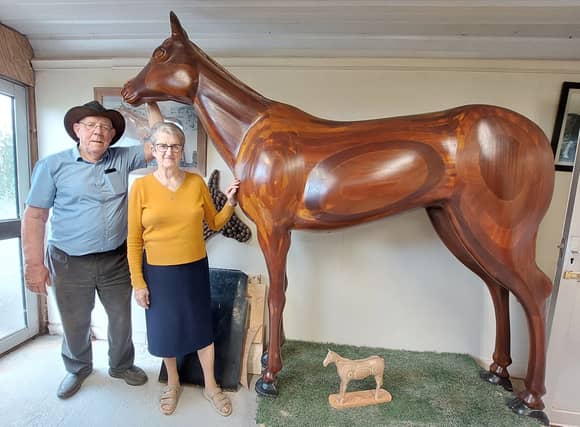 Charlie Burke and his wife Kathy with the mahogany horse he made for her, called Katcha.