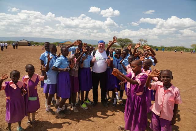 Ronan Scully of Self Help Africa is pictured with local people delivering supplies to various schools in Baringo County in Kenya.