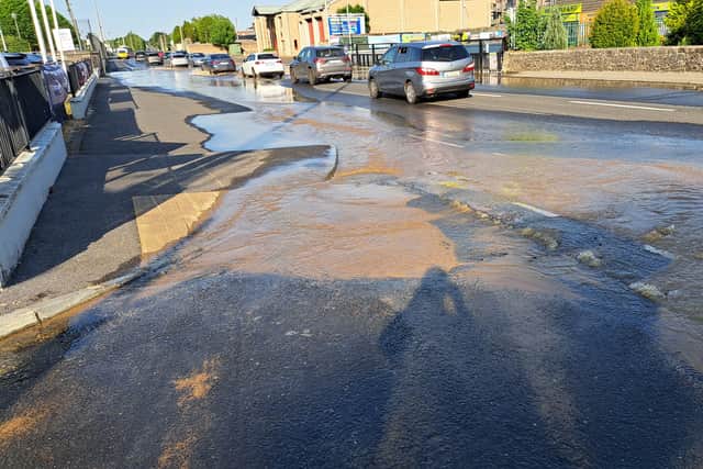 Murky water as it surged from the source of the leak on the Dublin Road on Tuesday evening around 7 pm.