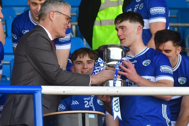 GAA President Jarlath Burns presenting Laois Captain David Dooley with the Allianz Division 2 Cup