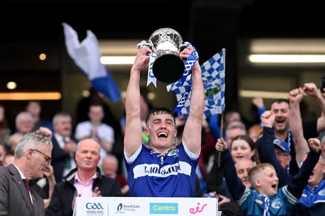 Laois captain David Dooley lifts the Joe McDonagh Cup. Photo by Ramsey Cardy/Sportsfile