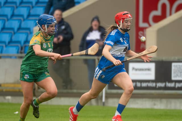 Kaylee O'Keeffee (Laois) breaking with Blathnaid Hughes (Meath) giving chase in their All Ireland Camogie Rd 2 game