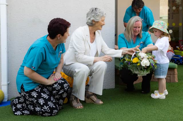 Lilie Ann, whose great-grandmother was one of the founding members of Portlaoise FRC, presented the President with a basket of flowers in the company of Debbie Smith, Suiamhneas Early Years Manager and Denise O’Riordan Deputy Manager.