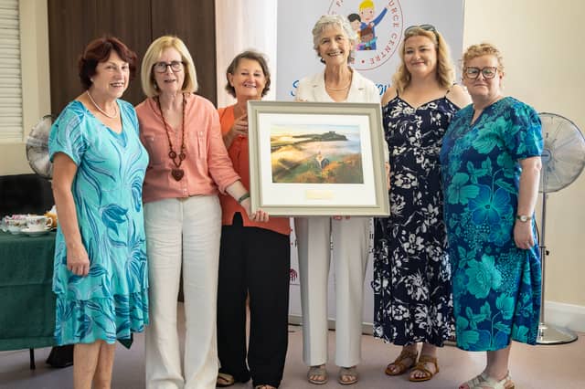 Pictured with President Catherine Connolly when she was presented with a photo of the Rock of Dunamaise taken by Terry Conroy were Patrice Dunne, Portt FRc, Chairperson, Helen Bonham Portlaoise FRC, Board Member, Caroline Conroy, Crafty Ladies and Wednesday Choir member, Joan Bolger, FRC Manager and Kathleen McEvot, FRC Financial Administrator. Pic: Terry Conroy
