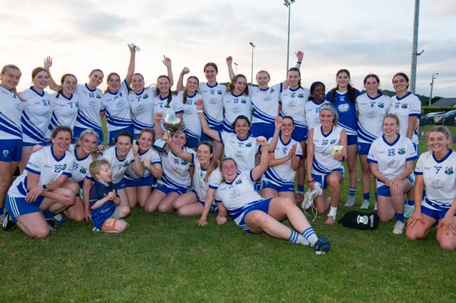 The St Conleth's team celebrate their Division One triumph on Saturday