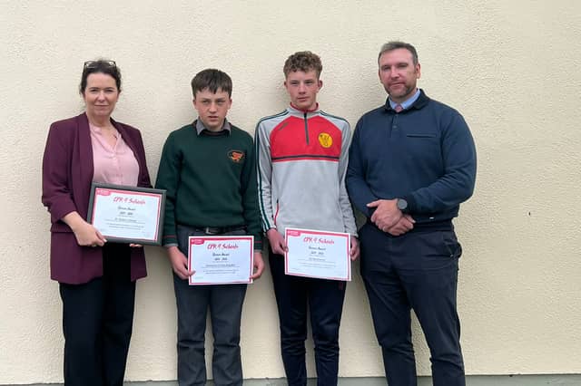 Carole Divine, Principal of St Fergal's College, with students Emmanuel Collins Begado and MJ Muldowney, who received the CPR 4 Schools Heroes Award, pictured with former Deputy Principal, PJ Delaney.