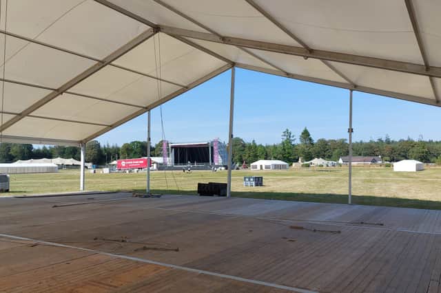 View of Forest Fest main stage from under the new Kickin’ Up Dust country music dance arena.