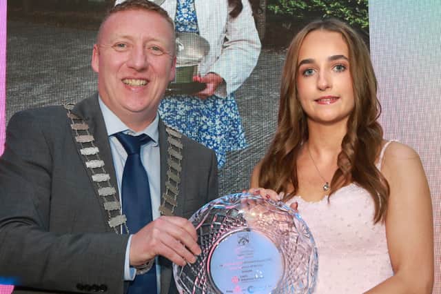 Cllr Barry Walsh of Laois County Council presents the Junior Volunteer  Award Category to Ailise Dowling McDonald at the 2025 Community & Voluntary Awards.