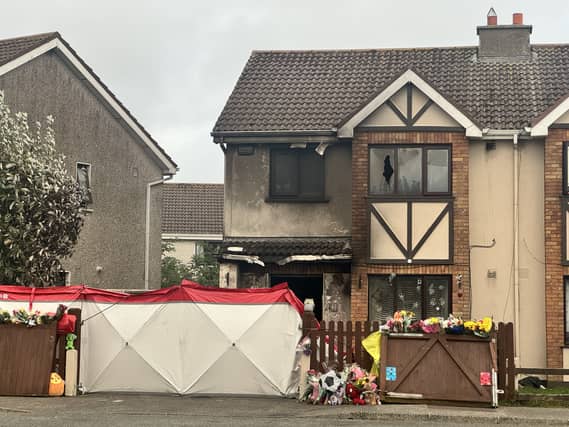 Floral tributes outside the house