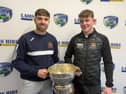 The Harps captain Padraic Dunne and Camross captain Cathal Cuddy