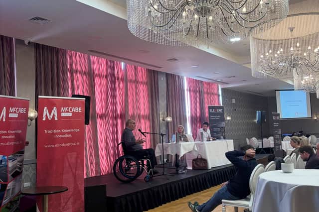 James Gorry speaking on stage. 