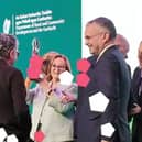 Mary White raises the trophy watched by chair Robbie Quinn, as Abbeyleix Tidy Town wins 2026 Ireland's Tidiest Small Town Award.