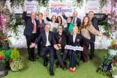 Ireland’s Tidiest Small Town 2026 - Abbeyleix, Co. Laois, at the 2026 SuperValu TidyTowns awards ceremony: Minister for Rural and Community Development and the Gaeltacht, Dara Calleary TD; Robbie Quinn, Chair of Abbeyleix Tidy Towns and Margaret Barron, Chief Marketing Officer at Musgrave; along with committee members from Abbeyleix Tidy Towns. 