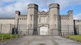 Allegedly threatened to stab Portlaoise Prison officer in the heart