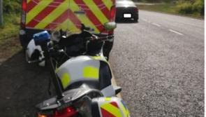PICTURE: Driver of car caught by Gardaí using mobile phone on major roadway in Ireland