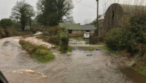 Dangerous road restricts access to water supply when 'submerged' by floods