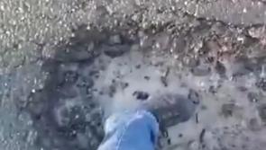 Watch: HUGE pothole damages car in Laois 