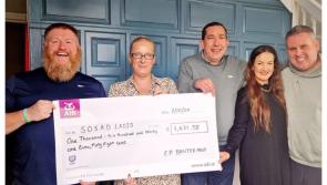 Electric Picnic Banter group present two mental health charities with cheques after Guinness World Record win